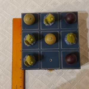 Wooden fishing themed tic tac toe box.